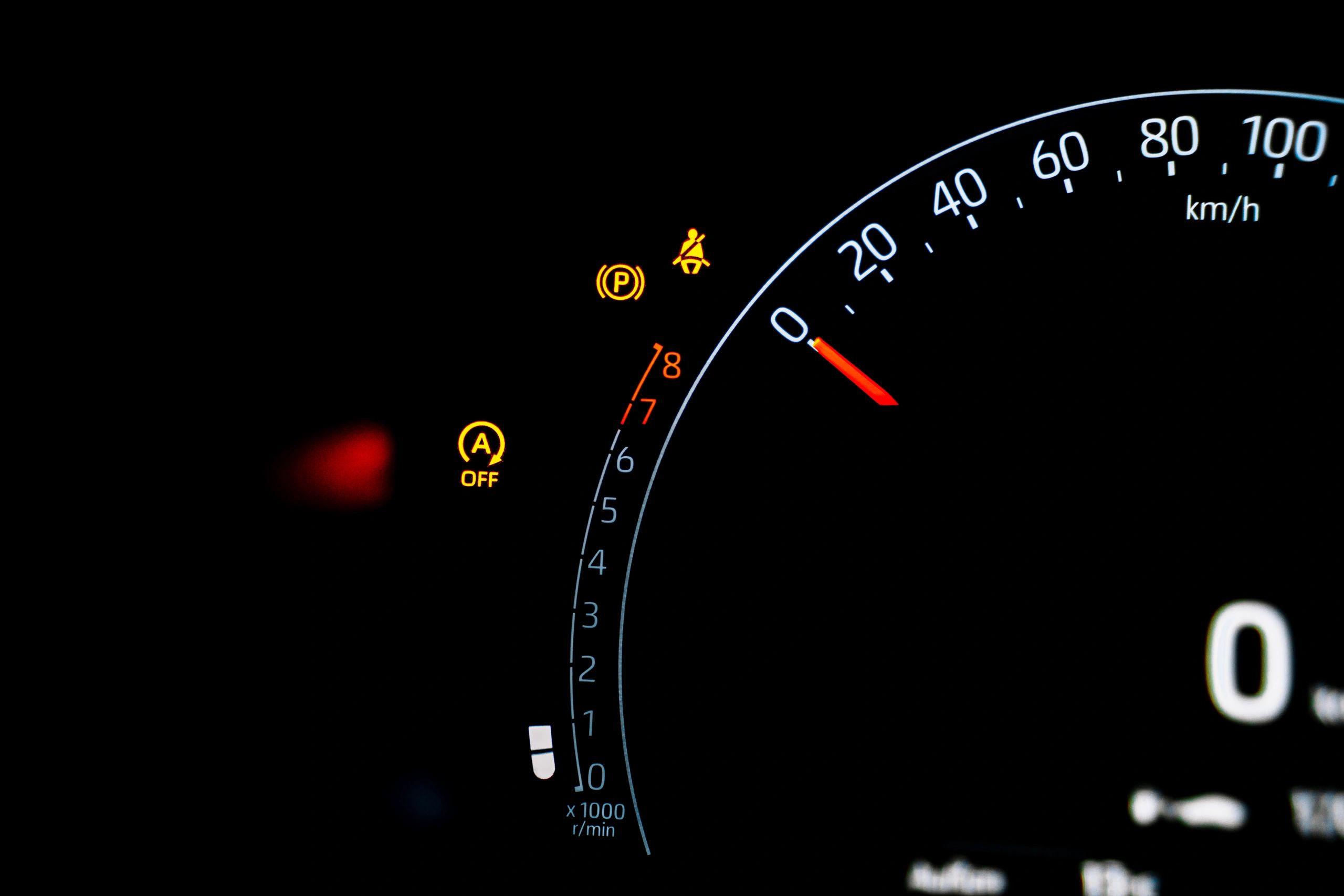 Dashboard gauges with warning indicators illuminated